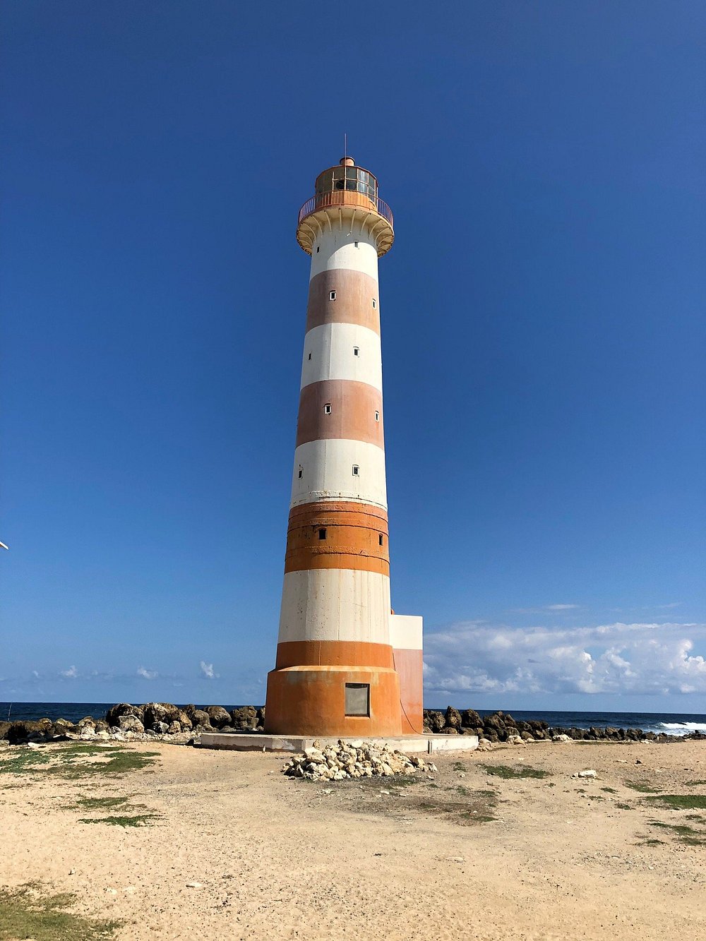 Tall Morant Point Lighthouse by the sea